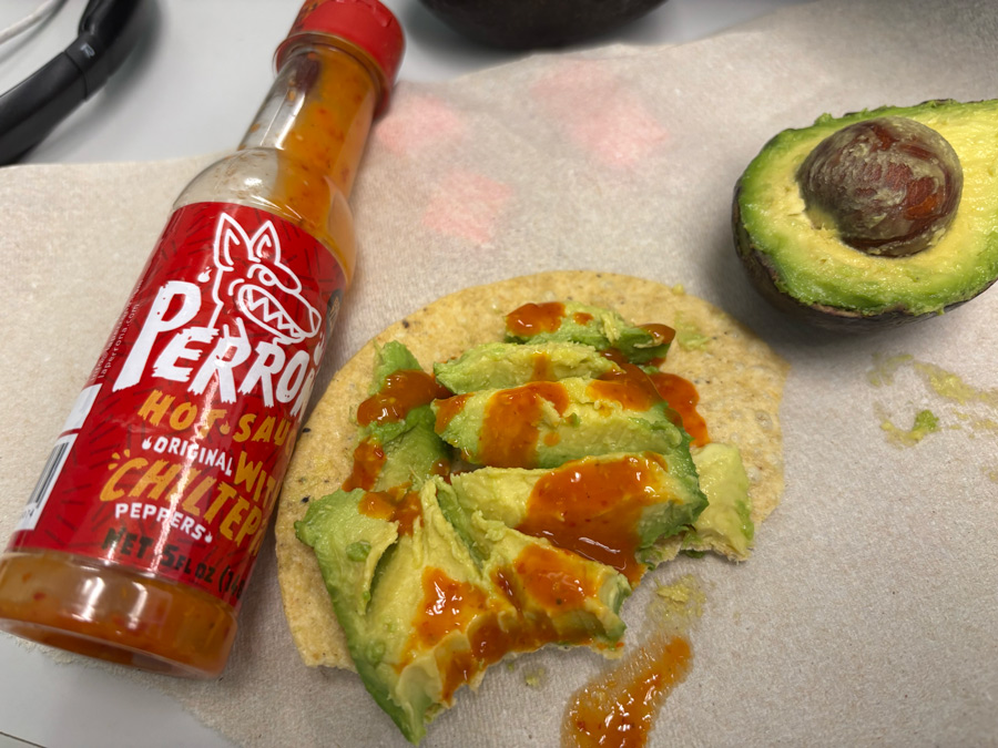 tostado with avocado and salsa perrona con chiltepin